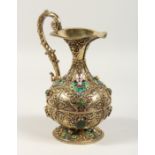 A SUPERB HUNGARIAN SILVER GILT CLARET JUG, mounted with pearl and other stones. 9ins high