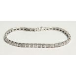 AN 18CT WHITE GOLD AND DIAMOND LINE BRACELET, diamond approx. 2ct. 18cm long