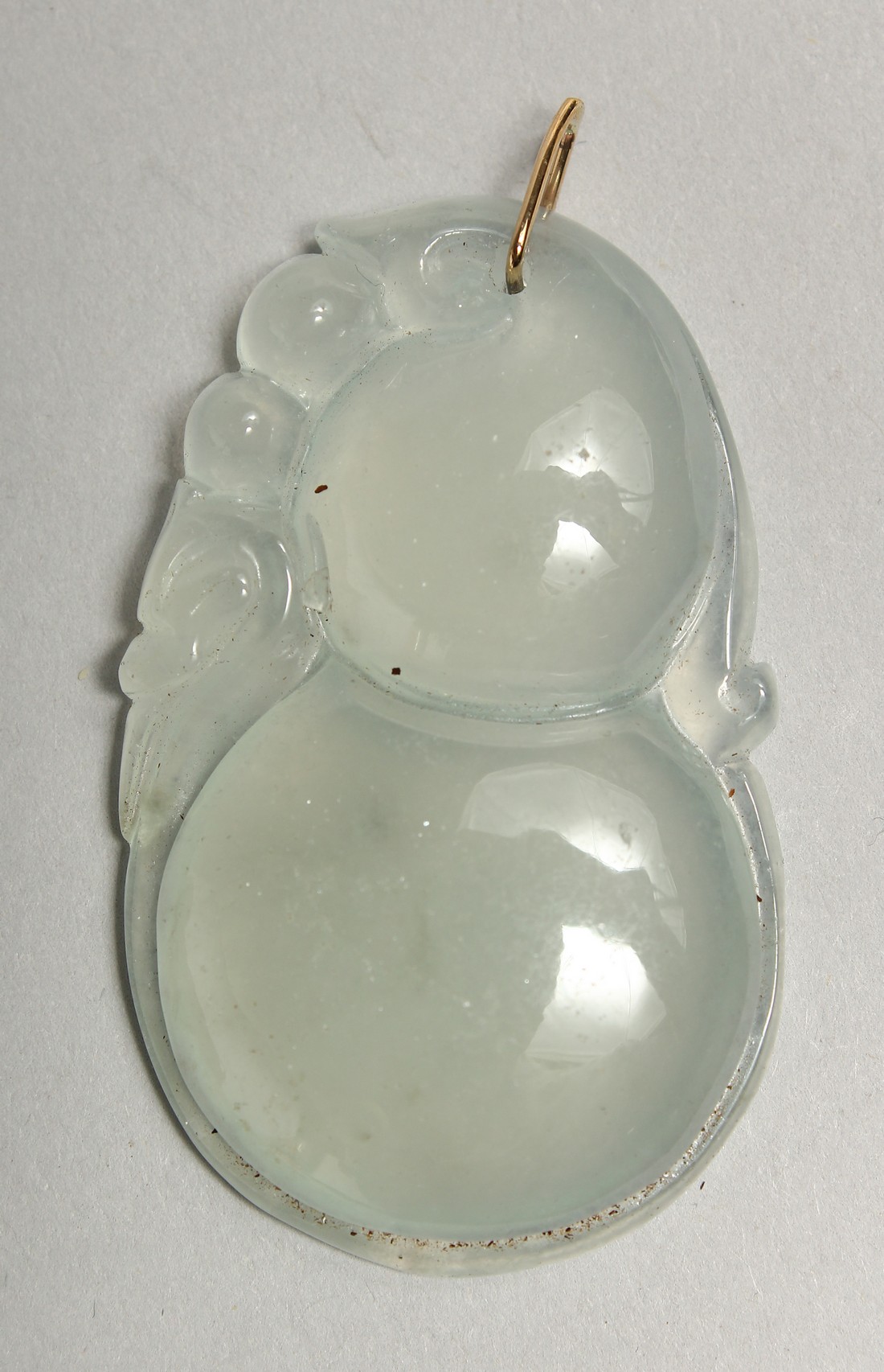 A GOLD TOP ICY JADE PENDANT