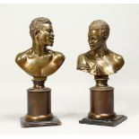 A SUPERB PAIR OF REGENCY BRONZE BUSTS OF AFRICAN FIGURES on bronze and wooden bases 11ins high