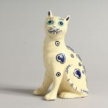 A SMALL GALLE STYLE POTTERY MODEL OF A CAT. 6ins high