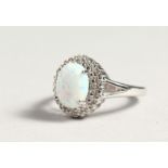 A SILVER OPALITE AND DIAMOND CLUSTER RING