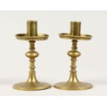 A SMALL PAIR OF BRASS TAPER OR CANDLESTICKS 4ins high