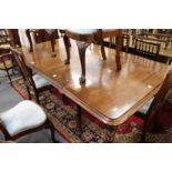 A GOOD VICTORIAN MAHOGANY EXTENDING DINING TABLE with 2 leaves on turned legs with castors. 9ft 8