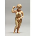 AN EARLY CARVED BONE NUDE 3ins long