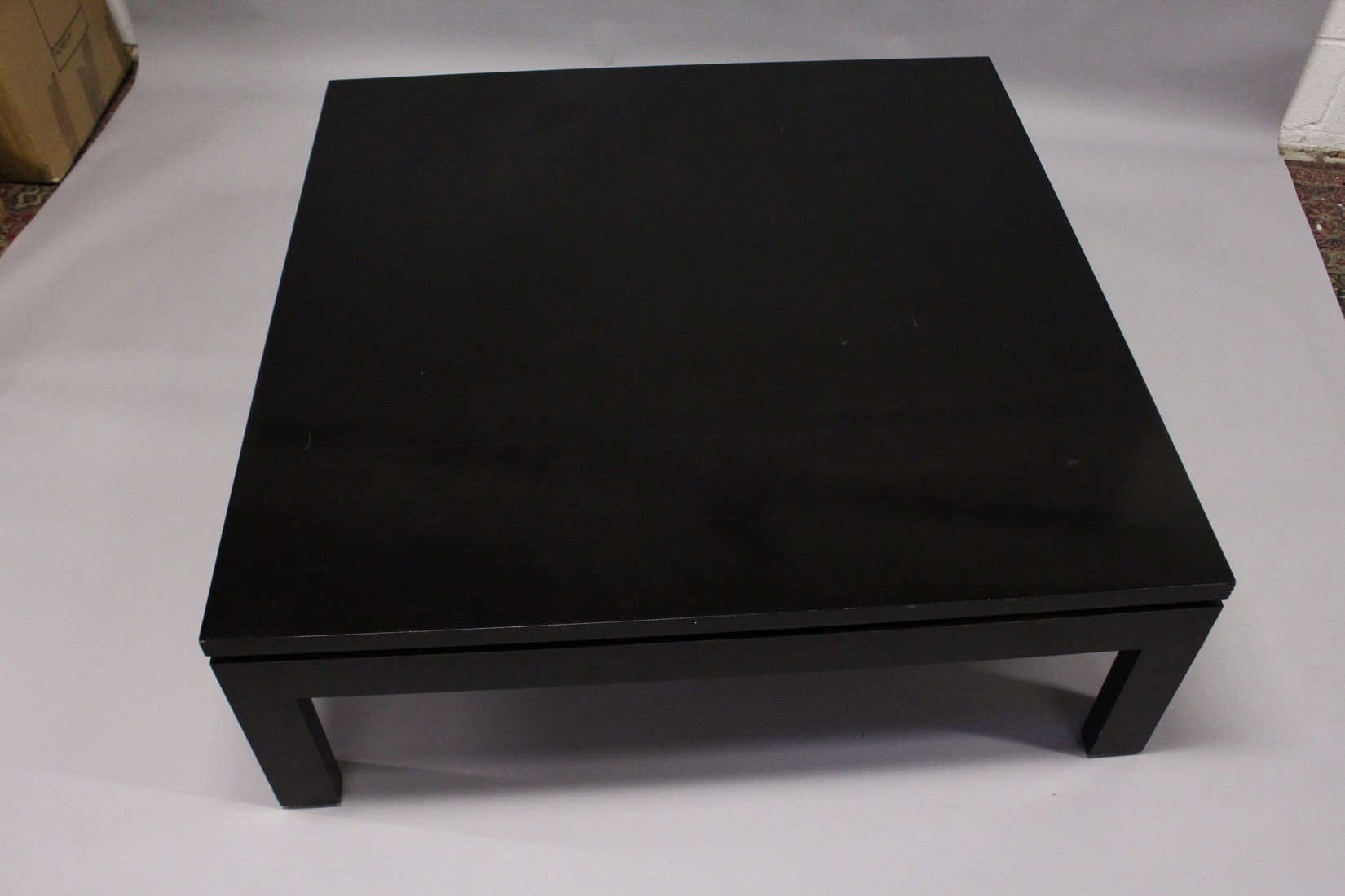 A LARGE EBONISED COFFEE TABLE, 20TH CENTURY, on square legs. 3ft 11.5ins x 3ft 11.5ins x 1ft 4ins. - Image 2 of 3