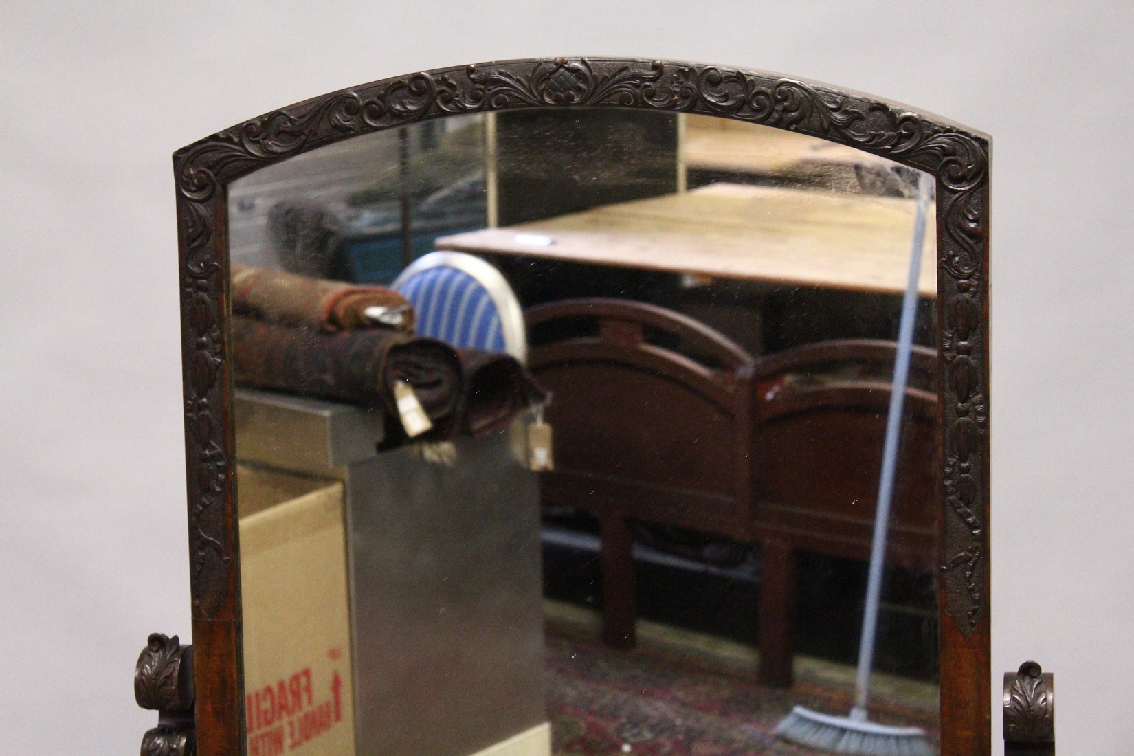 A GOOD IRISH CARVED MAHOGANY CHEVAL MIRROR, mirrored plate, the stand ending on castors. 4ft x 2ft - Image 4 of 5