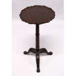 A GEORGE III DESIGN MAHOGANY TRIPOD TABLE, with pie-crust top, turned column on three carved legs