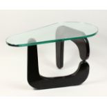 AN UNUSUAL MID 20TH CENTURY 'BOOMERANG' TABLE with plate glass top and ebonised supports 34ins long