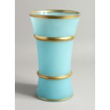A LIGHT BLUE GLASS VASE with gilt band.