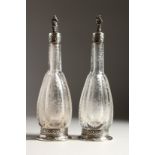 A VERY GOOD PAIR OF EUROPEAN SILVER MOUNTED, ETCHED GLASS, RECTANGULAR WINE BOTTLES, the glass