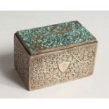 AN ISLAMIC SILVER BOX, the lid with turquoise mosaic 3.5ins