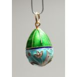 A RUSSIAN SILVER AND ENAMEL EGG PENDANT.