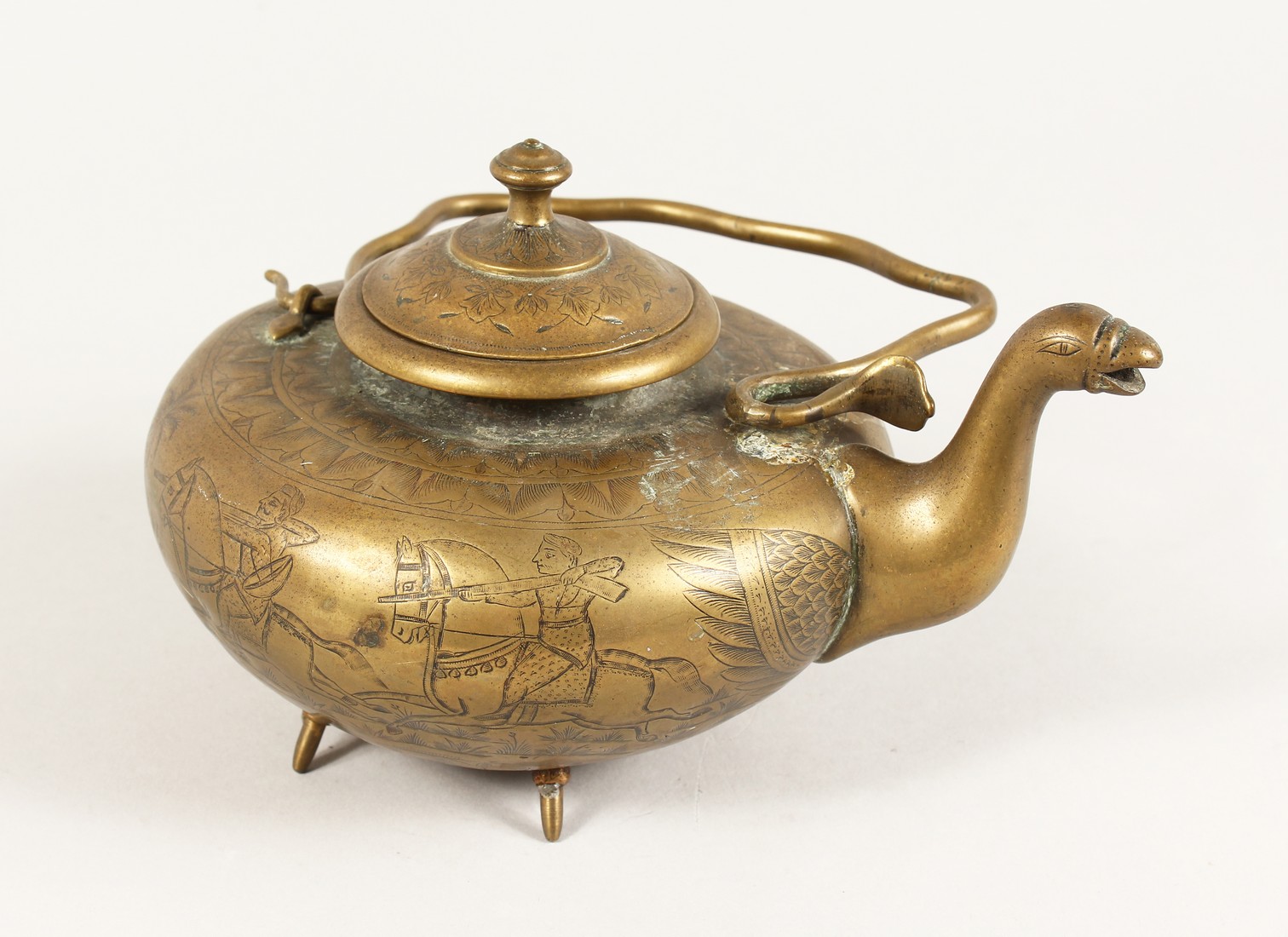 AN ENGRAVED MIDDLE EASTERN CIRCULAR KETTLE