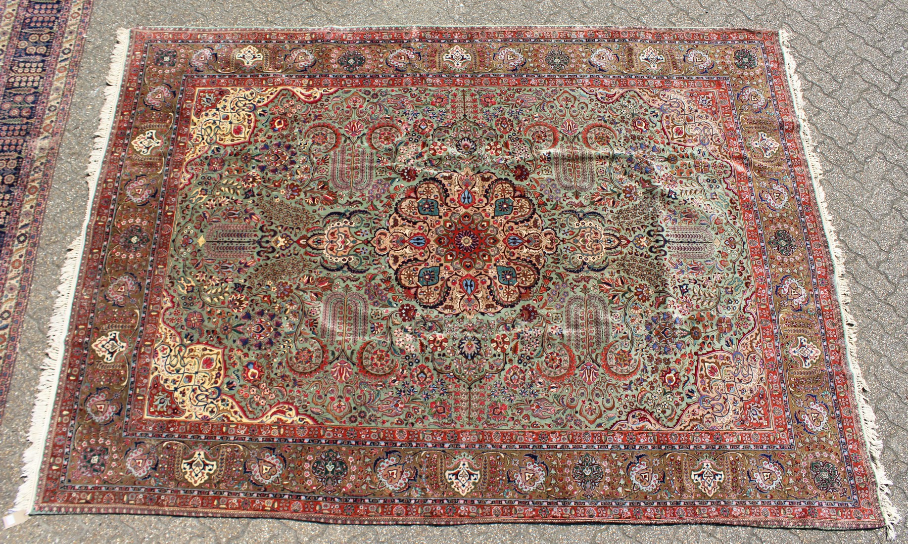 A LARGE PERSIAN TABRIZ CARPET, pale green ground with all over stylised floral decoration within a