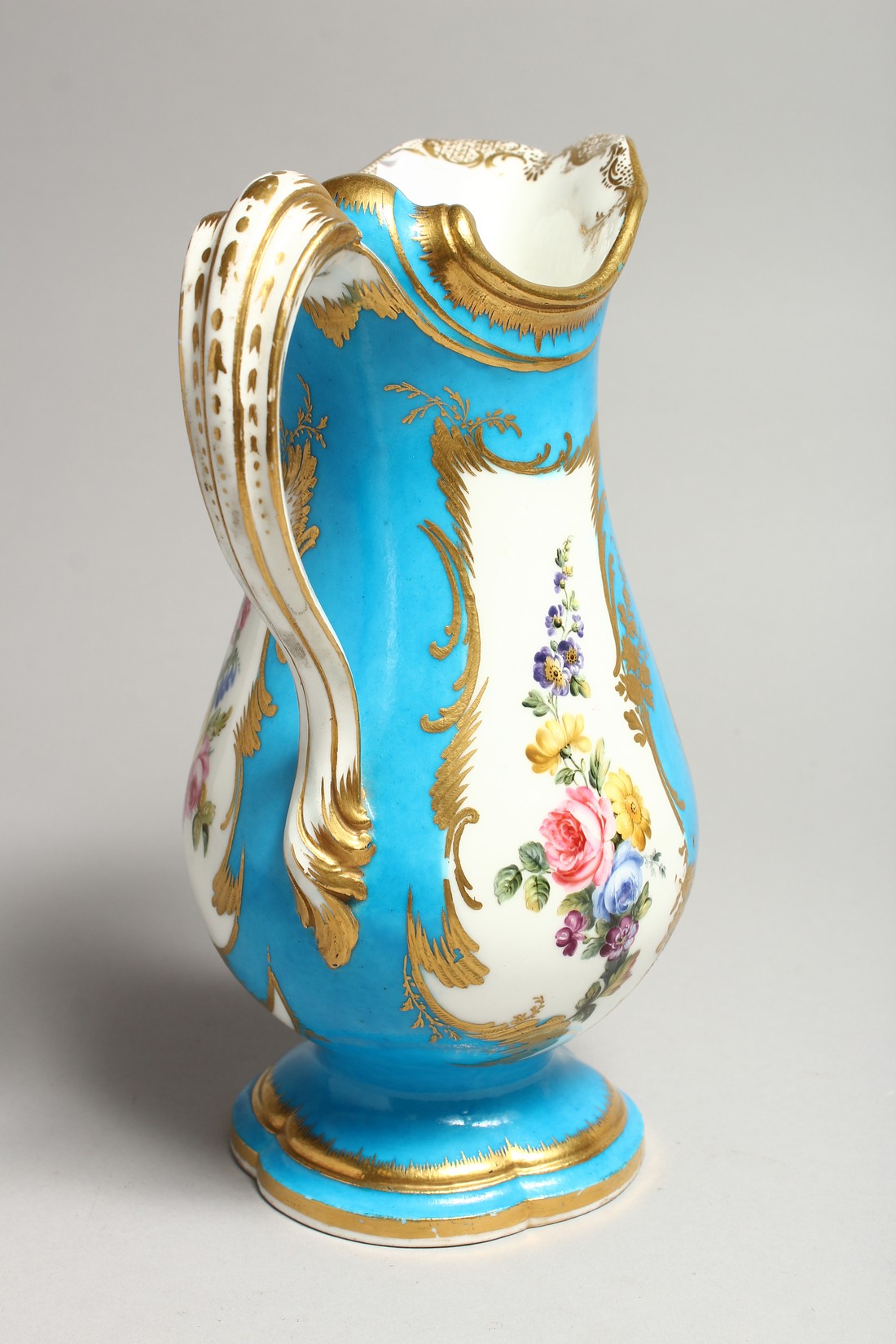 A GOOD SEVRES PORCELAIN EWER, blue ground edged in gilt and painted with three panels of figures and - Image 4 of 7