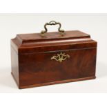 A GEORGE III MAHOGANY THREE DIVISION CADDY with banded top, brass carrying handle and escutcheon.