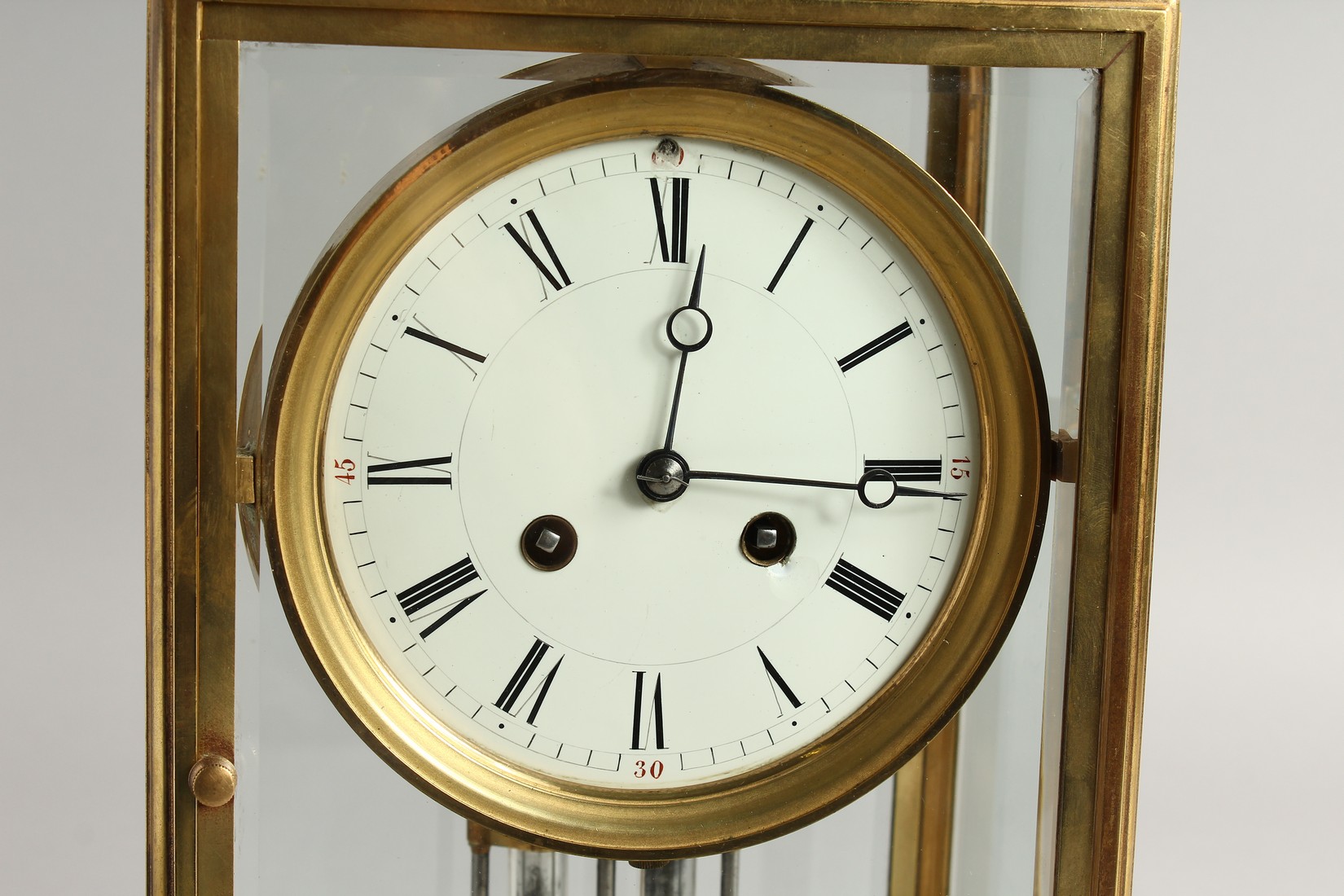 A GOOD BRASS FOUR GLASS CLOCK with white dial and pendulum. 12ins high. - Image 2 of 12