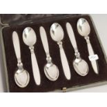 A GOOD SET OF 6 GEORG JENSEN CACTUS PATTERN SILVER CASED COFFEE SPOONS