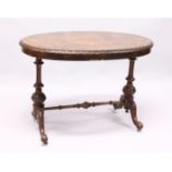 A VICTOTIAN FIGURED WALNUT OVAL STRETCHER TABLE with quartered top carved edges on turned legs