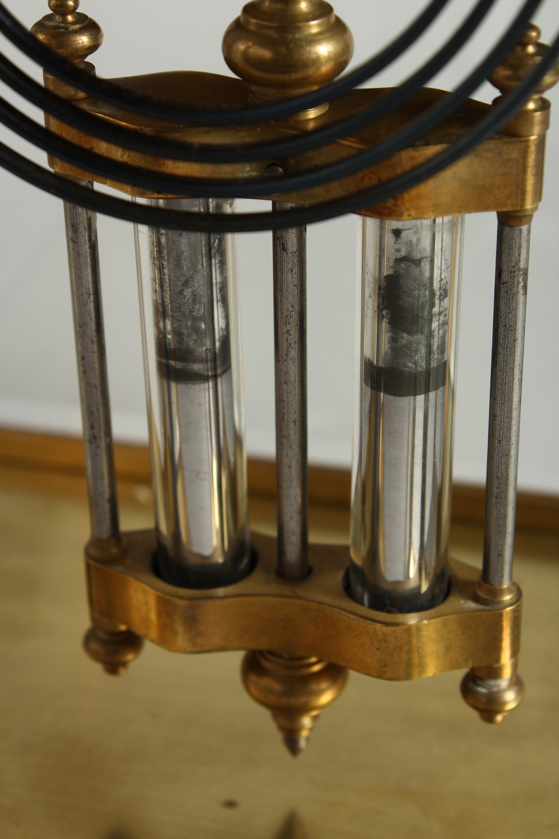 A GOOD BRASS FOUR GLASS CLOCK with white dial and pendulum. 12ins high. - Image 6 of 12