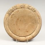 AN OLD CARVED WOOD CIRCULAR BREAD BOARD "THE STAFF OF LIFE" 12ins diameter
