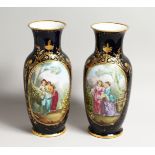 A SUPERB LARGE PAIR OF SEVRES PORCELAIN VASES rich deep blue, painted with a large panel of girls,