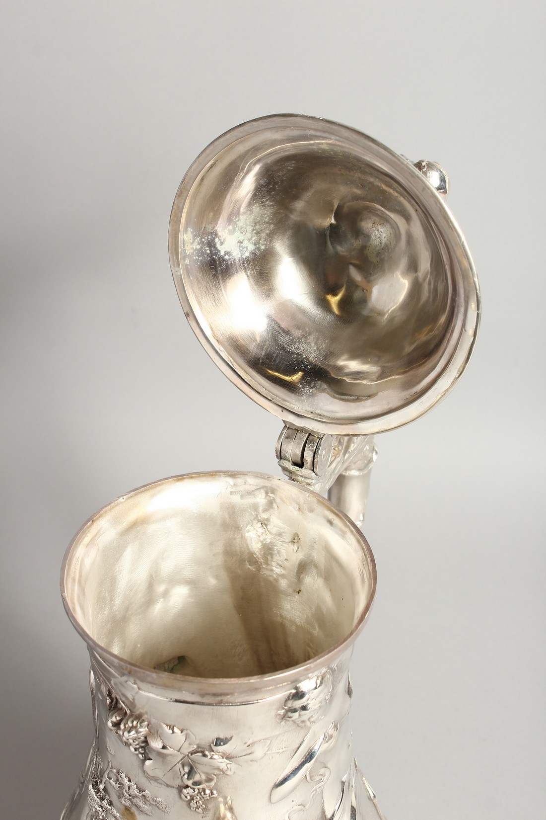 A GOOD W.M.F PLAIN TANKARD covered with classical repousse decoration. 16ins high. - Image 5 of 6