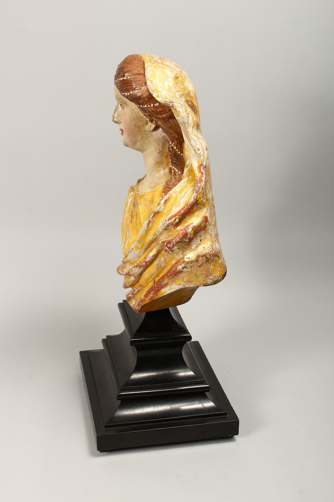 A 18TH CENTURY WOOD AND POLYCHROME DECORATED BUST OF A YOUNG LADY, on ebonised stepped base Bust - Image 3 of 3