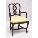 A SMALL GEORGE II DESIGN MAHOGANY OPEN ARMCHAIR with curved cresting, wavy splats, shepherd’s