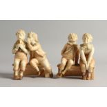 TWO AMUSING ROYAL WORCESTER BLUSH IVORY PORCELAIN GROUPS, each depicting two cheeky boys seated on a