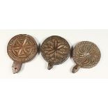 THREE CARVED WOOD CIRCULAR BUTTER MOULDS 4.5ins - 5ins diameter