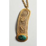 A FILEGREE AND GREEN STONE PENDANT AND CHAIN