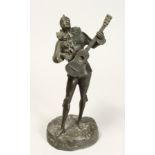 SIGINIERT MASORE A GOOD STANDING BRONZE OF A PIEROT playing a guitar. Signed, MASORE 13ins high.