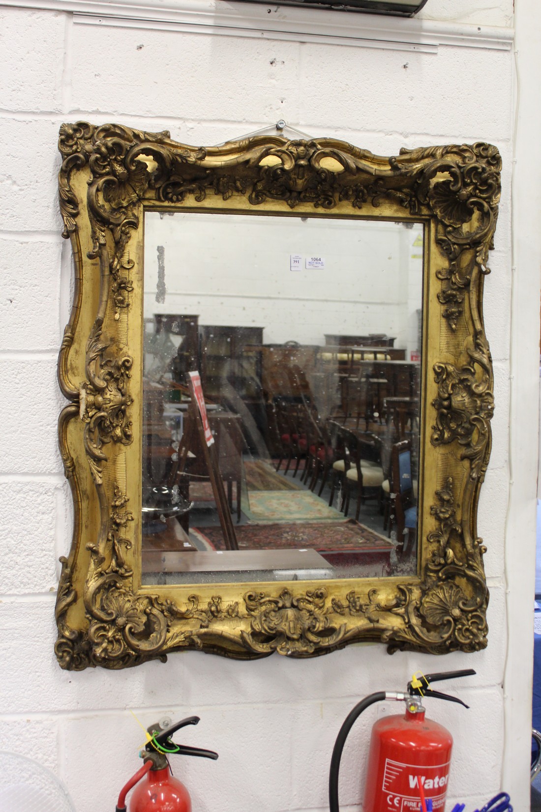 A LARGE AND IMPRESSIVE 19TH CENTURY GILT FRAMED MIRROR