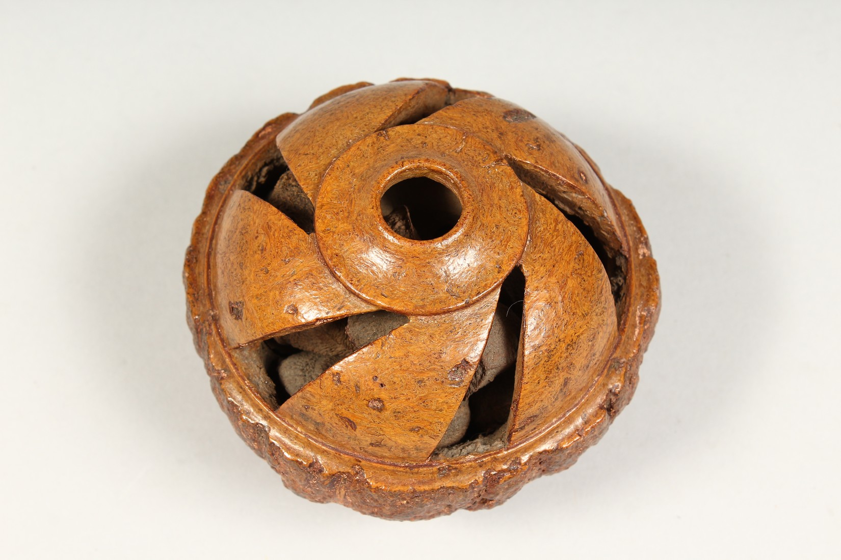 A TREEN BRAZIL NUT, carved and pierced, Desborough Collection. 4ins diameter - Image 3 of 4