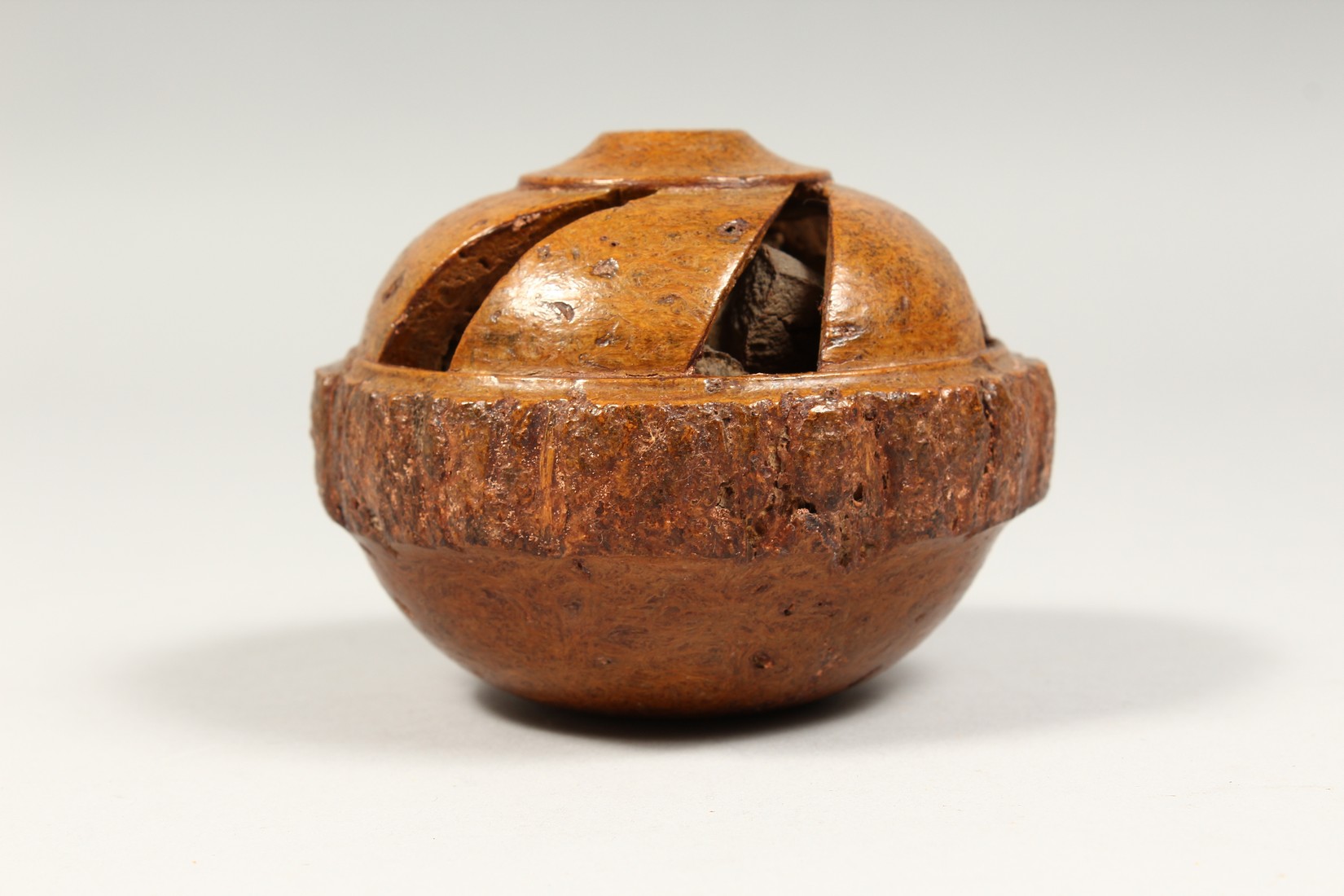 A TREEN BRAZIL NUT, carved and pierced, Desborough Collection. 4ins diameter - Image 2 of 4