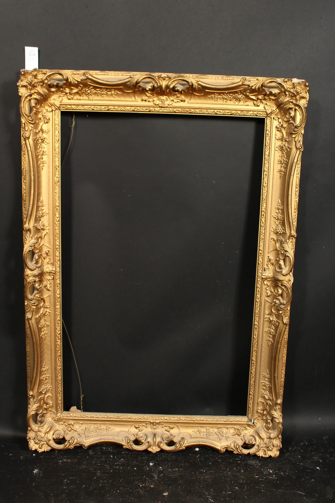 A 19th century gilt composition swept frame, rebate size 22.5 x 35.5 , 57cm x 90cm. - Image 2 of 3