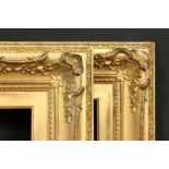 A pair of 19th century gilt composition swept frames, rebate size each 10 x 20 , 25.5cm x 51cm.