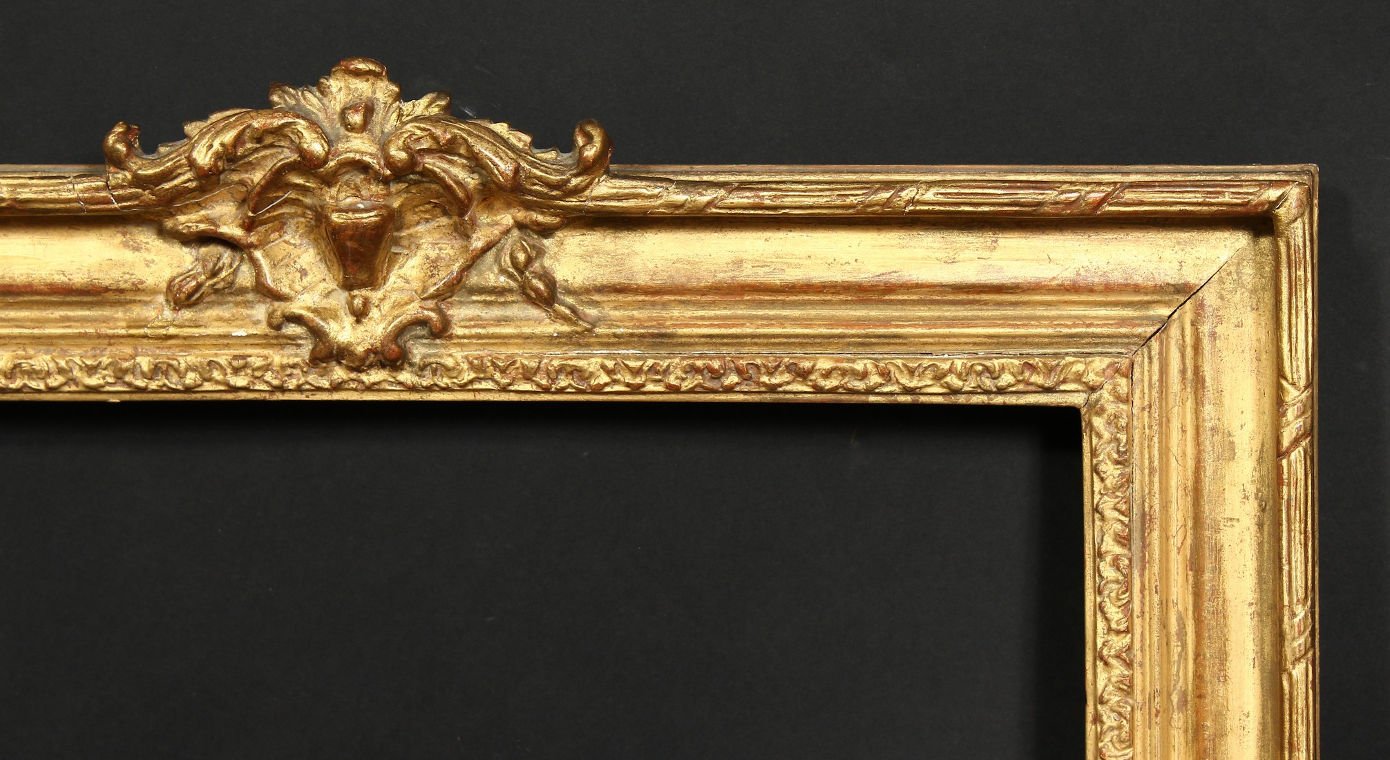 An early 20th century gilt composition frame with central cartouche, rebate size 19.75 x 16.5 , 50cm