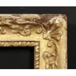 An early gilt composition frame with moulded inner ornament, wide rebate 16 x 13 , 40.5cm x 33cm.