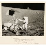 A photograph taken of the lunar landing from Apollo XII, signed and dedicated on the mount by