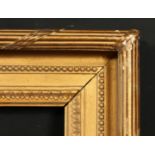 A 19th century gilt composition frame with moulded and ribbon tied top ornament, rebate size 13 x