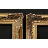A pair of early 20th century gilt composition swept frames, rebate size 18 x 32 , 46cm x 81.5cm, (