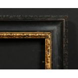 An 18th century carved and ebonised frame with a gilded inner ornament, rebate size 16 x 20.25",