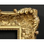 A 19th century carved wood frame with locking inner front ornament, rebate size 12 x 16 , 31cm x