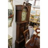 A 19th century mahogany long case clock with painted arched dial.