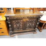 A Victorian Jacobean revival carved oak sideboard.