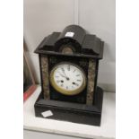 A Victorian black slate mantle clock.