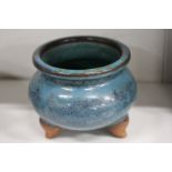 A Chinese tripod censer with turquoise glazed decoration.
